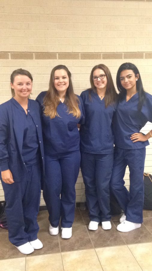 Clinical rotation students seniors  Meaghan McDowell, Hannah Carvajal, Chelsey Whitney and Crystal Lorenzo on the first day dressing in scrubs for the year. 