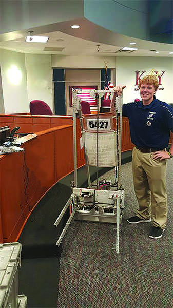 Senior Conor Devlin with the award winning robot.