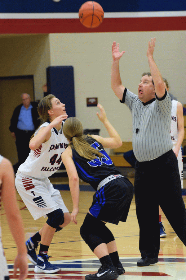 Senior Brittany Panetti preparing to hit the ball in the tip off towards one of her teamates.