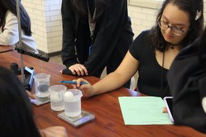 Girls in S.T.E.M member diligently focuses on the egg in beaker, studying it's effects. Girls in S.T.E.M put an emphasis on empower girls that want to pursue a career in the S.T.E.M field. 