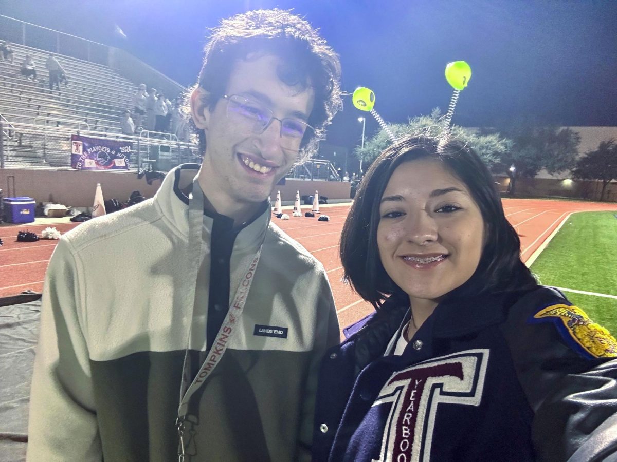 Sapphira and Nathan enjoy the game from the sideline.