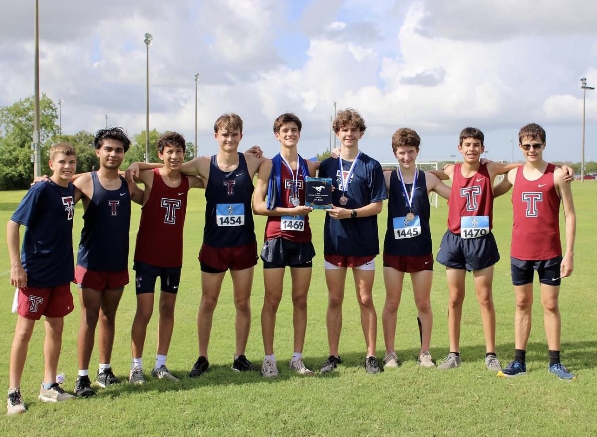 The boys track team getting first place at their tournament 